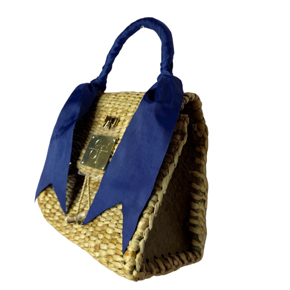 Small envelope style handbag with navy blue ribbon